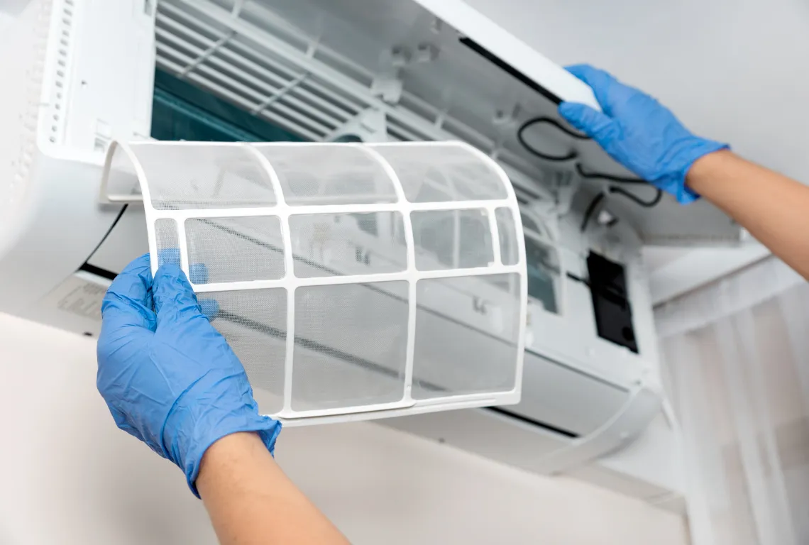 Removing a heat pump filter for cleaning